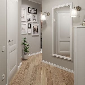 a gray hallway with wood floor