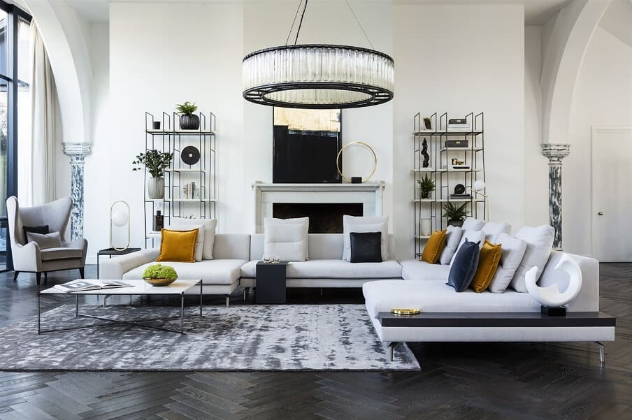 comtemporary living room setting with white walls and furniture and dark floors