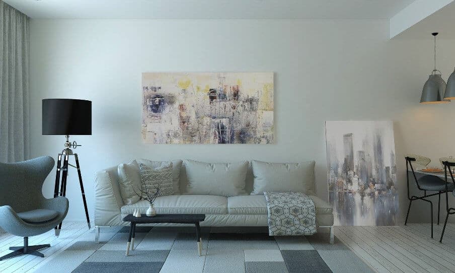 a mid-century style gray sofa and armchair living room setting