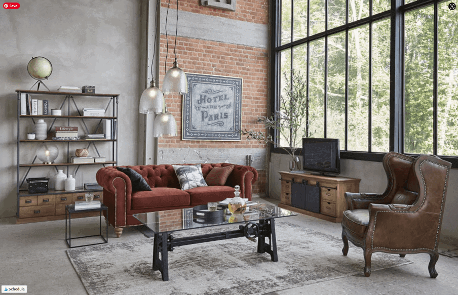galss and metal coffee table in an industrial living room setting