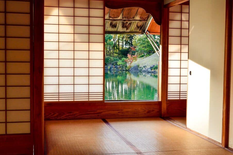Entrance to a Japanese home and looking through an open door to a pond beyond