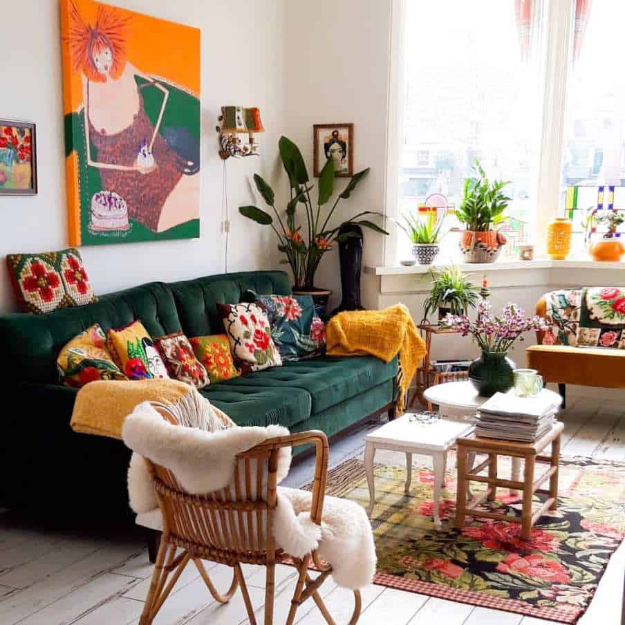 living room setting with green velvet sofa at the centre 