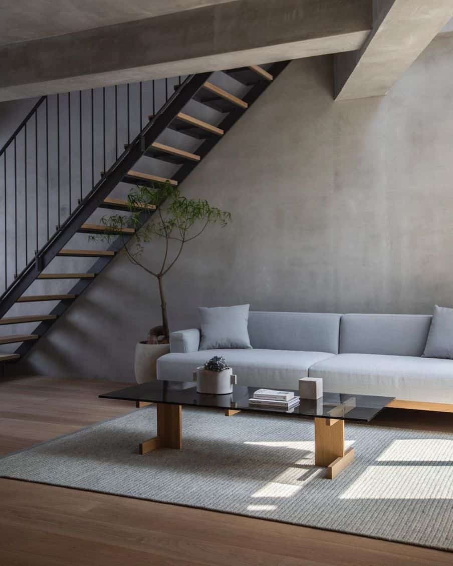 a gray sectional sofa in an open plan area