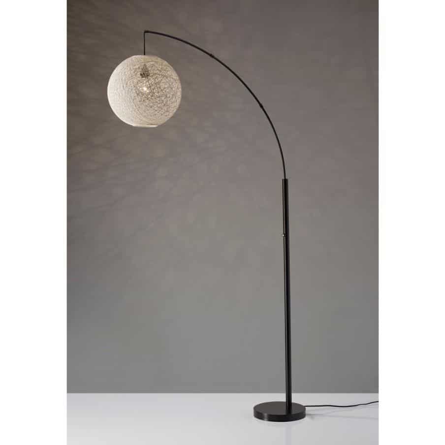 a bronze floor standing arched lamp