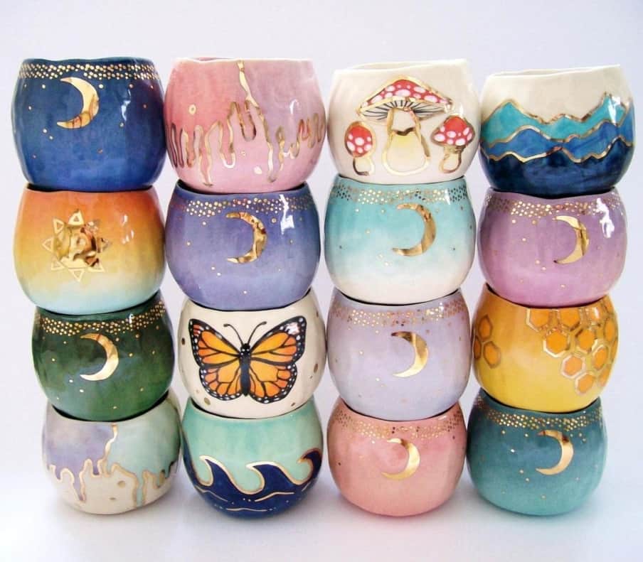 many cups with moons and butterflies