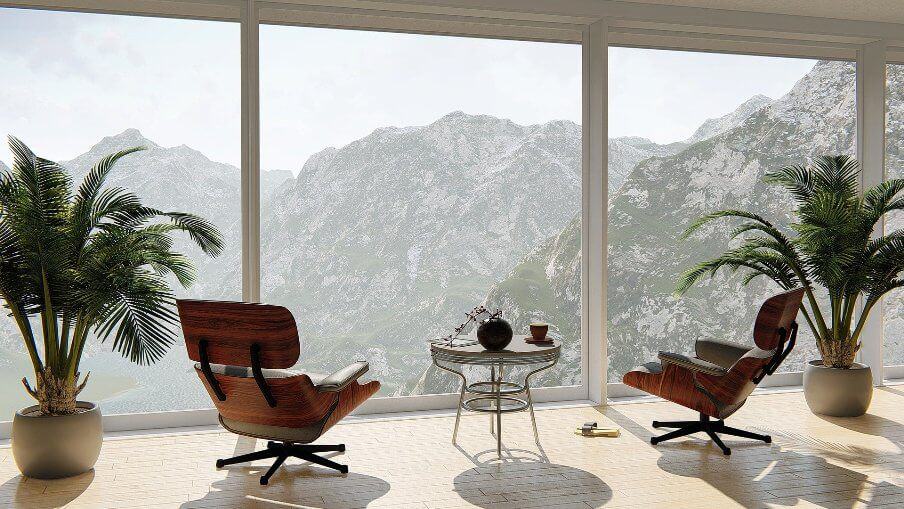 view of a mountain scene through large picture windows of apartment