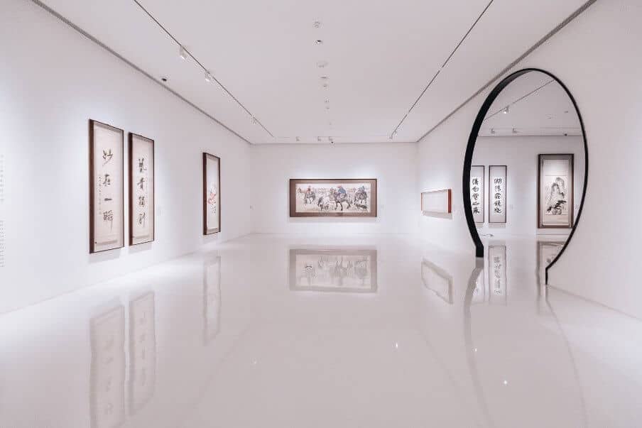 view of an art gallery with white backdrop