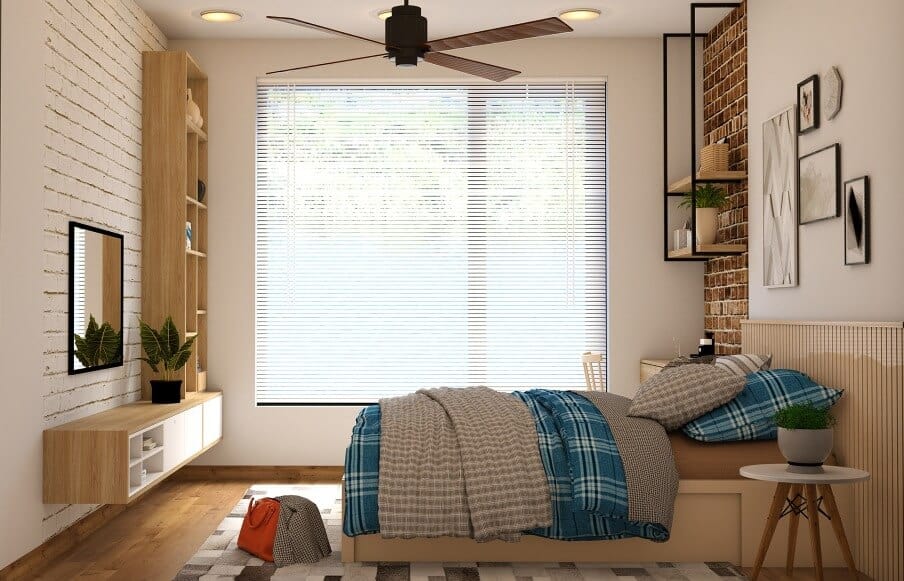 a bedroom with a ceiling fan and minimalist furnishing